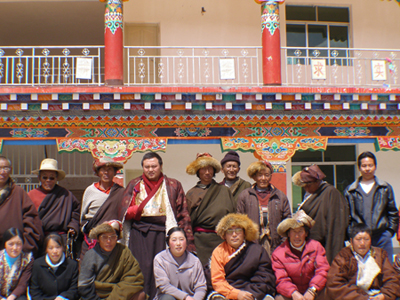 Arik Rinpoche and school teachers in front of the elementary school