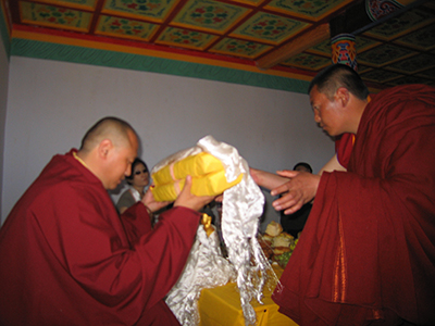 Arik Rinpoche giving holy dharma texts