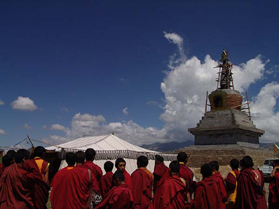 monks around a stupa under construction