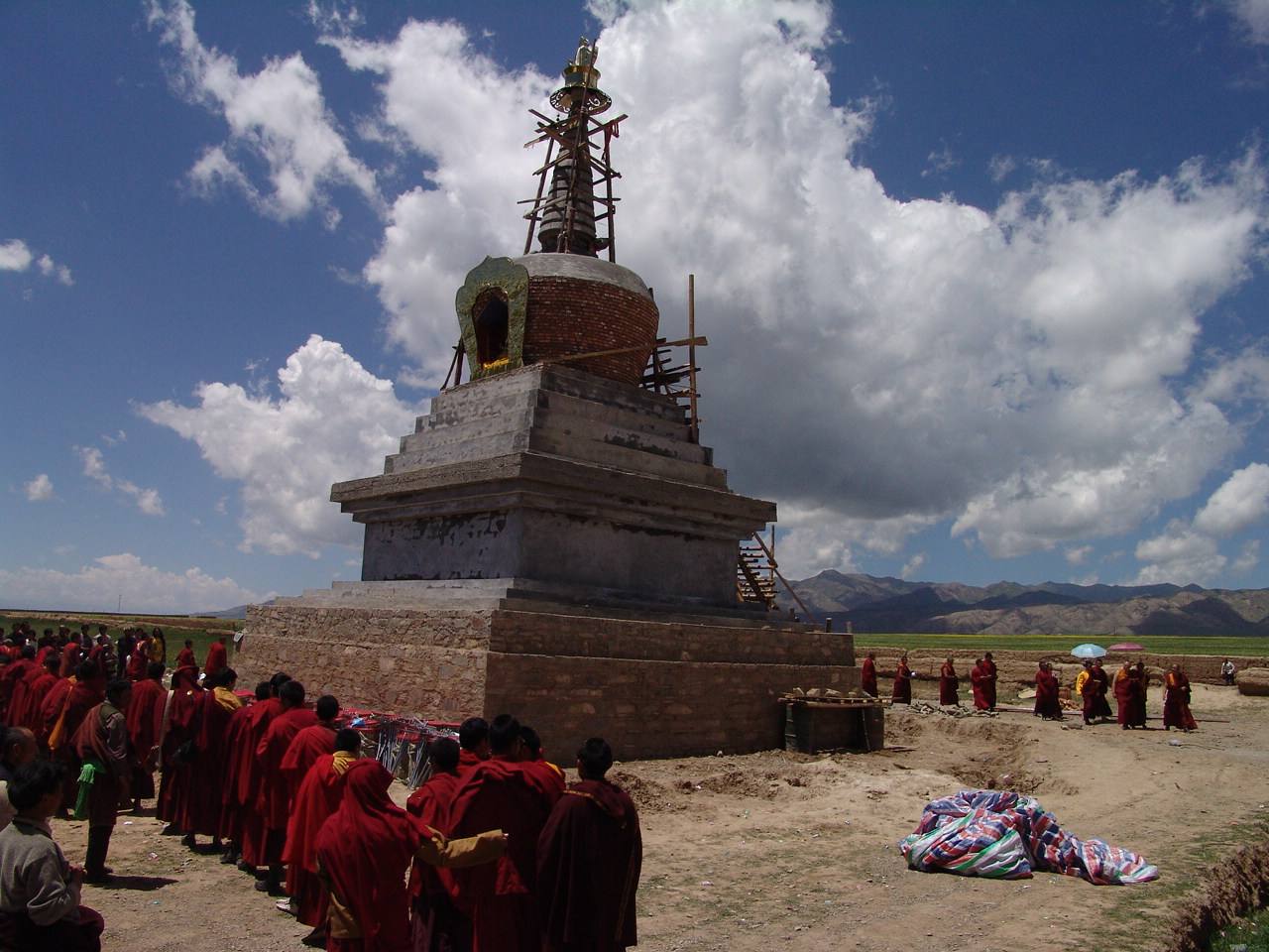 monks around a stupa under construction